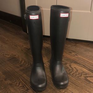 Barley worn black hunter boots